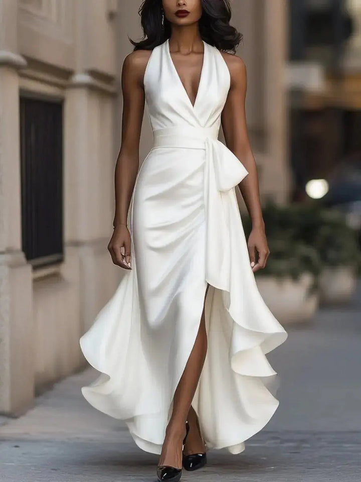 Chic women's halter formal dress with high-low hem, a beautiful bow waist, perfect for glamorous events.