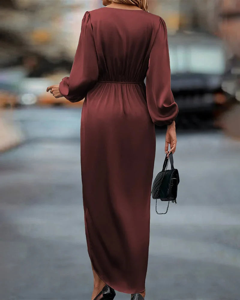 Sophisticated women's V-neck wrap midi dress in burgundy. Long-sleeve draped design, ideal for occasion wear.