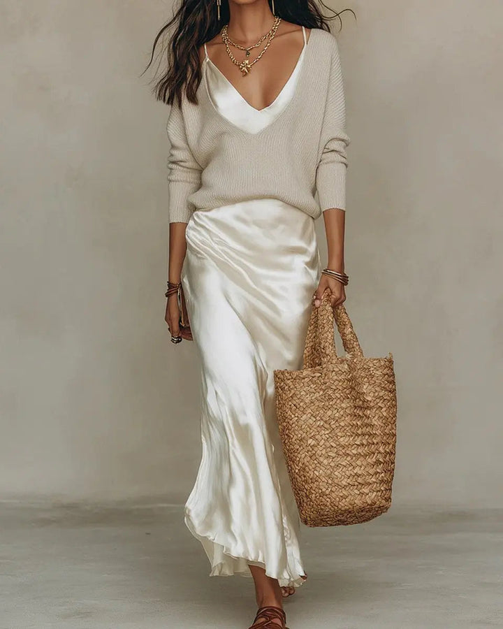 Women's layered satin V-neck midi dress with a long-sleeve jumper, an elegant and versatile outfit for evening.