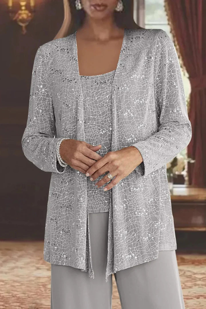 Elegant sequin jacket for women, paired with wide leg pants; a stunning party outfit.