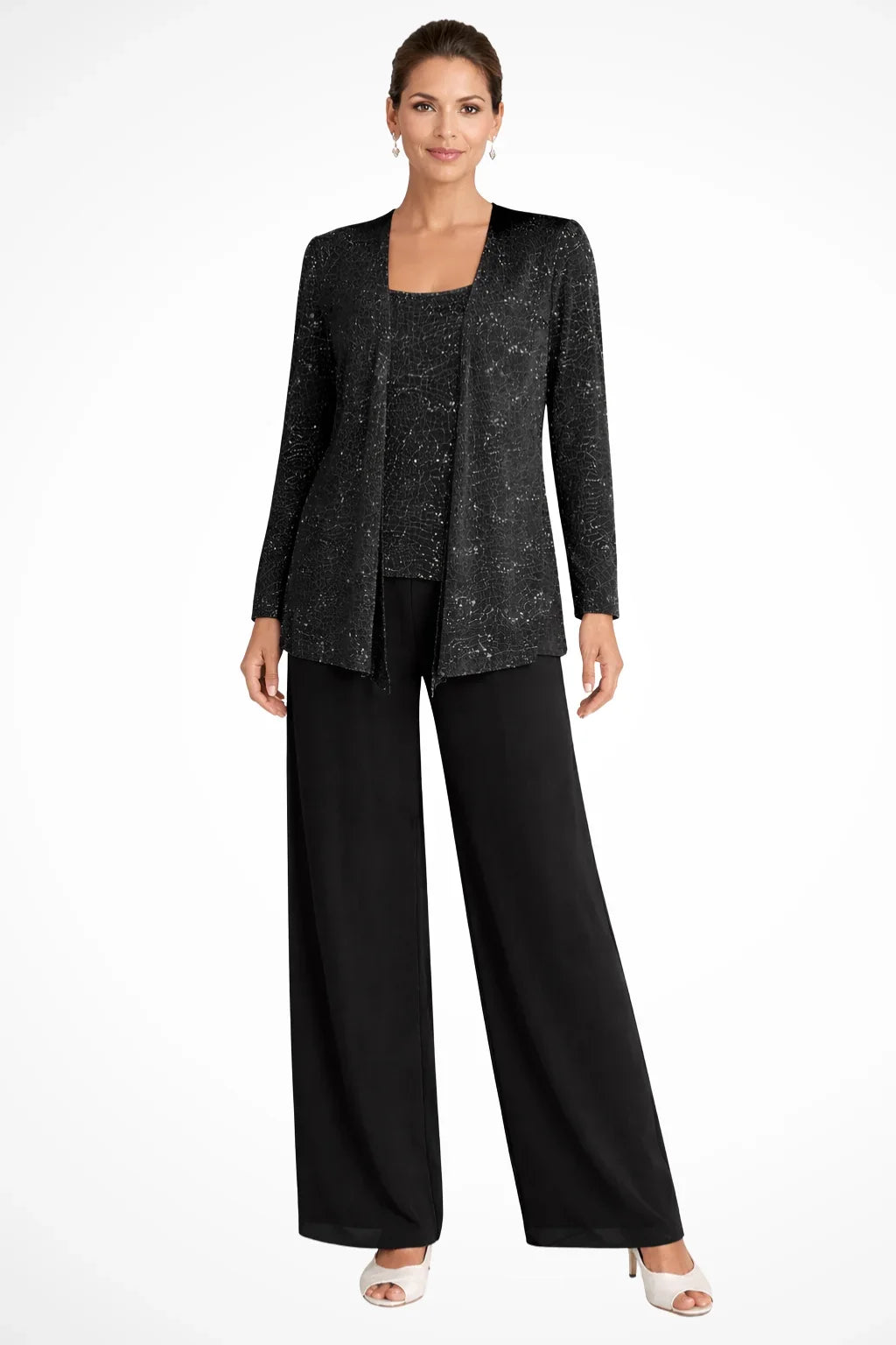 Close-up of sparkling sequin fabric on women's wide leg pant set, luxurious evening wear.