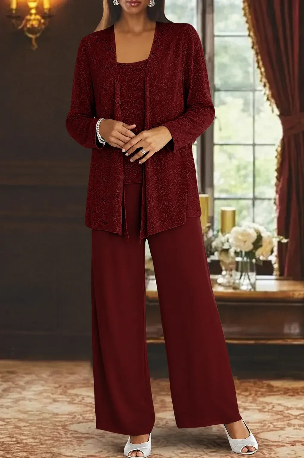 Women's sequin wide leg pant set with jacket, showcasing elegant movement & shimmering details.