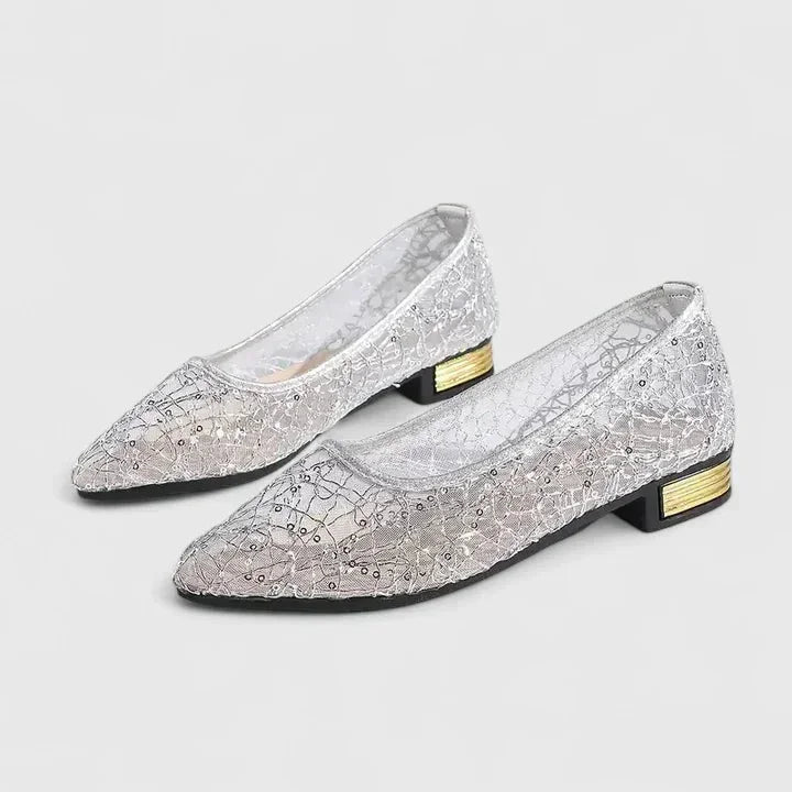 Sophisticated women's pointed-toe sheer lace flats with a low heel. Ideal for elegant and comfortable wear.