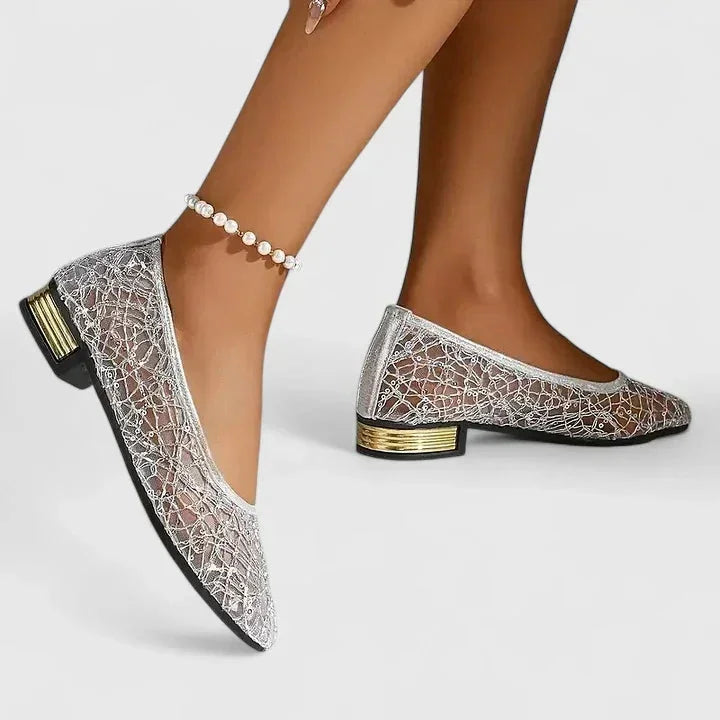 Gold women's sheer lace pointed-toe flats with a delicate low heel, ideal for elegant evening or daytime wear.