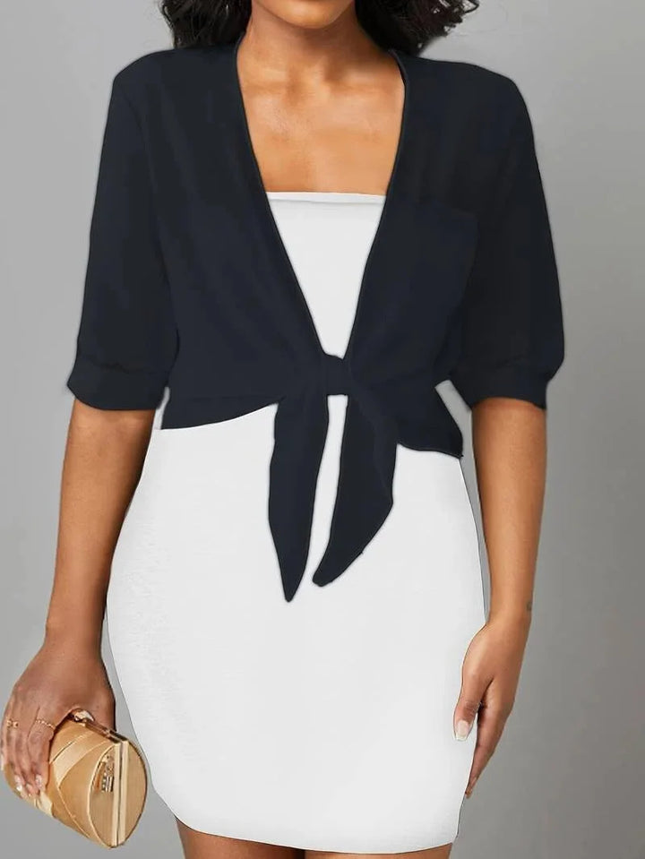 Casual women's sheer blouse featuring a stylish tie-front and comfortable 3/4 sleeves.