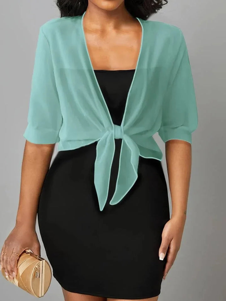 Lightweight sheer tie-front blouse for women, featuring 3/4 sleeves, great for casual outfits.