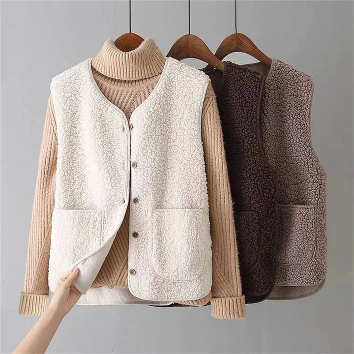 Women's cozy button-front v-neck vest with patch pockets, perfect for autumn layering.