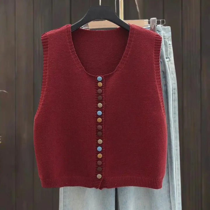 Women's button-front vest, sleeveless for versatile layering, chic casual style, a wardrobe staple.