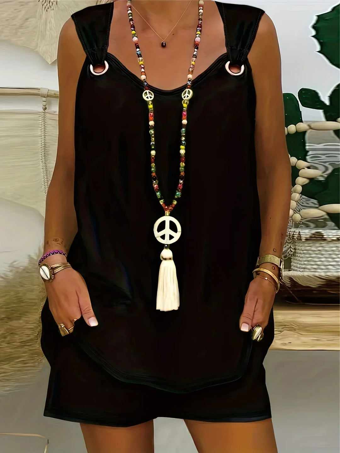 "Women's sleeveless romper with ring strap, pockets; elegant summer jumpsuit, lightweight fabric for chic, relaxed outings."