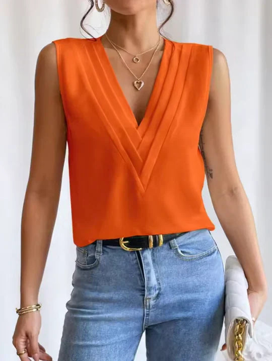 "Women's sleeveless V-neck top, chic simplicity, soft lightweight fabric, flattering fit, versatile style, elegant design."