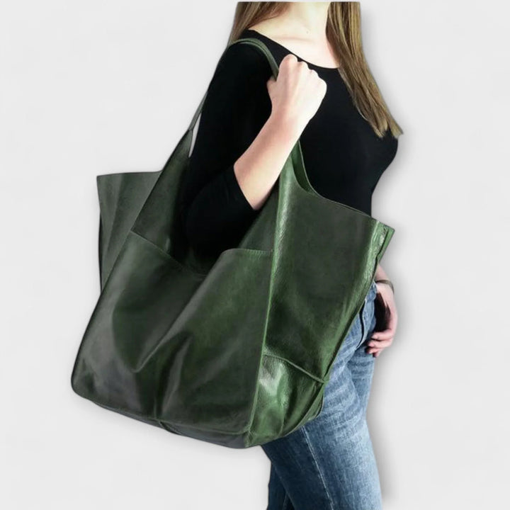 Durable faux leather tote bag for women, designed with a spacious interior and practical outside pockets.
