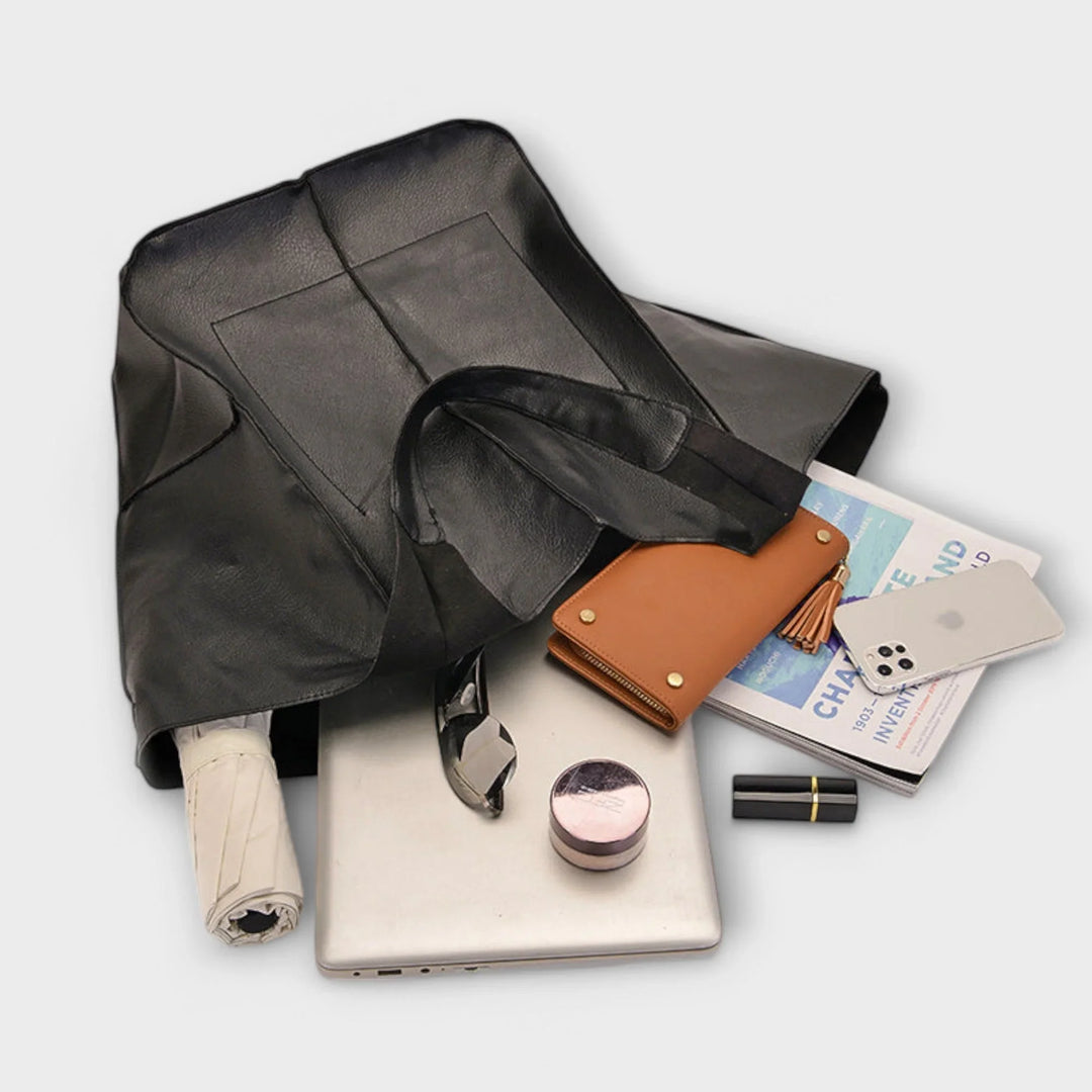 Elegant women's handbag: spacious faux leather tote with multiple exterior compartments.