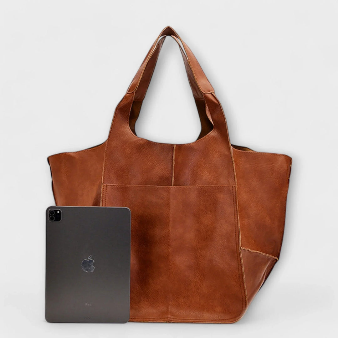 Fashionable women's everyday carry bag, a roomy faux leather tote with useful exterior pockets.