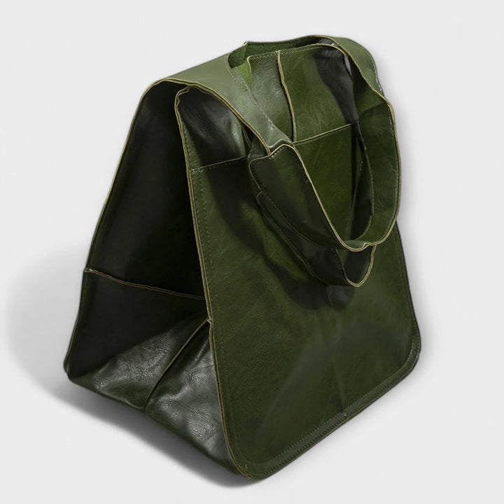 Stylish women's faux leather shoulder bag; roomy interior & practical exterior pockets.