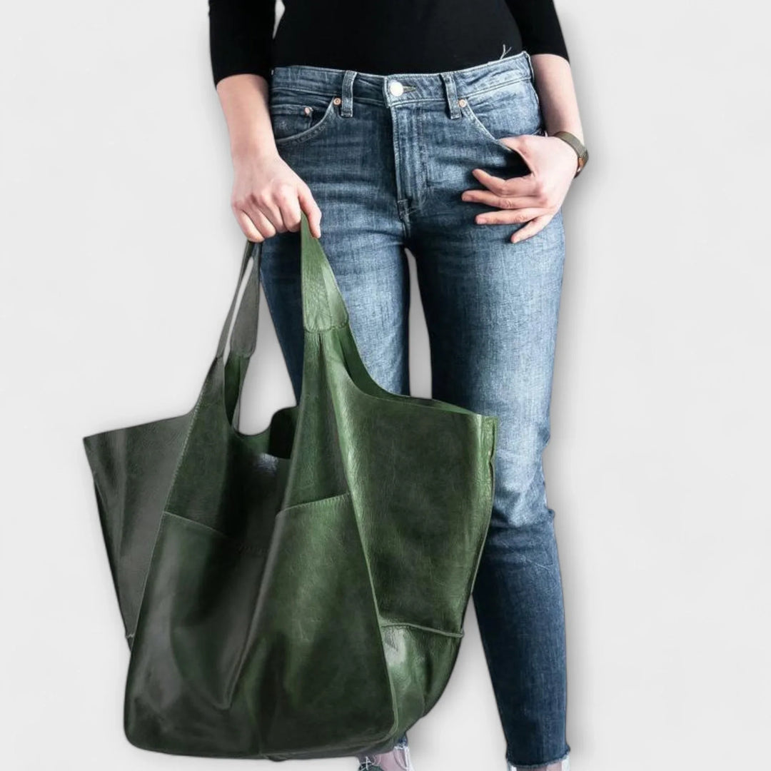 Women's modern faux leather everyday tote, designed for comfort and organization with exterior pockets.