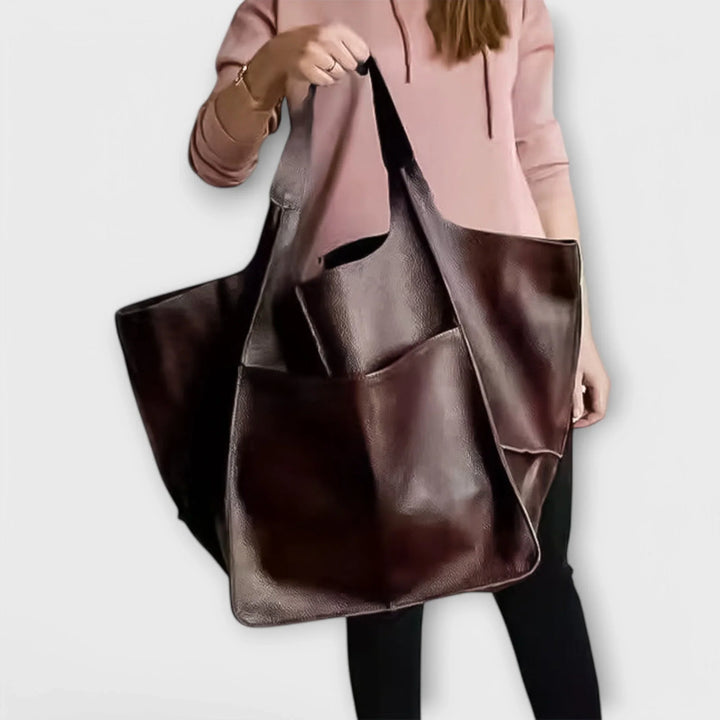 Sophisticated women's spacious faux leather tote, ideal as a fashionable everyday carry bag with exterior pockets.