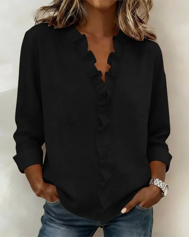 Chic women's blouse with ruffle V-neck & long sleeves. Relaxed fit for effortless spring fashion & versatile style.