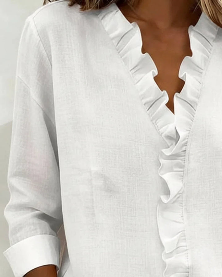 Versatile women's long-sleeve ruffle V-neck blouse, offering a relaxed fit. Great for casual chic or elegant office wear.