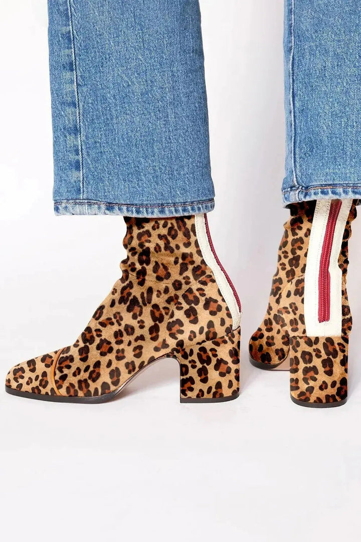Trendy women's square toe block heel ankle boots. Offers comfort and style for versatile winter fashion.