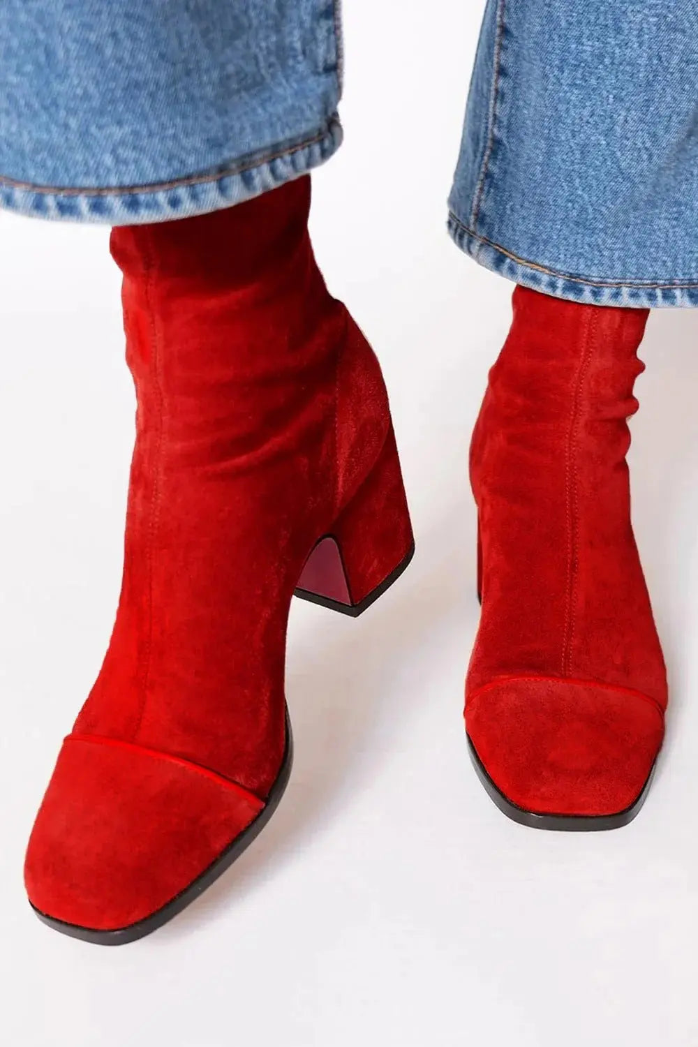 Modern women's square toe block heel ankle boots. Comfortable and stylish for versatile outfits.