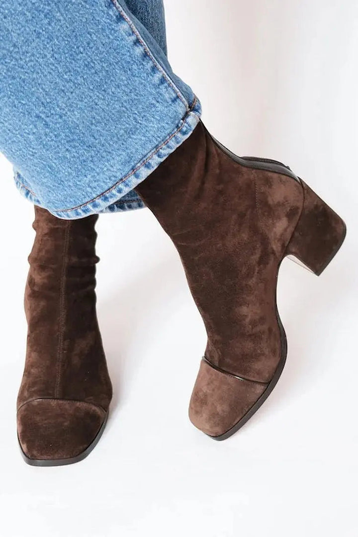 Versatile women's square toe block heel ankle boots. Trendy footwear for chic autumn and winter fashion.