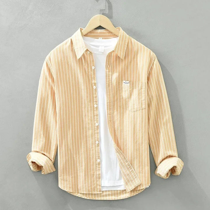 Stylish grey striped long-sleeve women's shirt, casual button-up with chest pocket, perfect for versatile fashion.