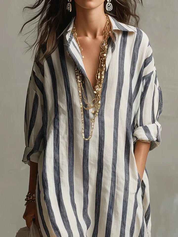 Casual women's striped shirt maxi dress featuring comfortable roll-tab long sleeves for effortless style.