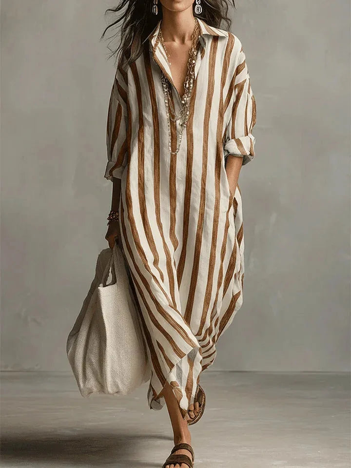 Flowy women's striped maxi shirt dress with roll-tab long sleeves, great for a breezy summer day out.