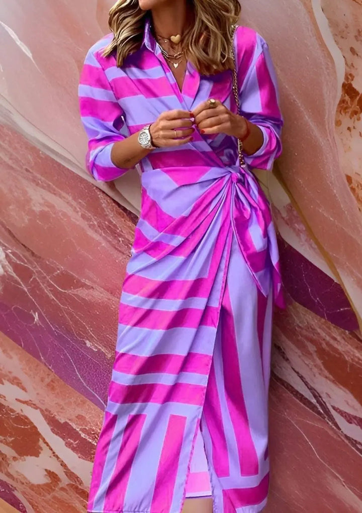 Flattering V-neckline of a striped long sleeve midi wrap dress, elegant & versatile for women.