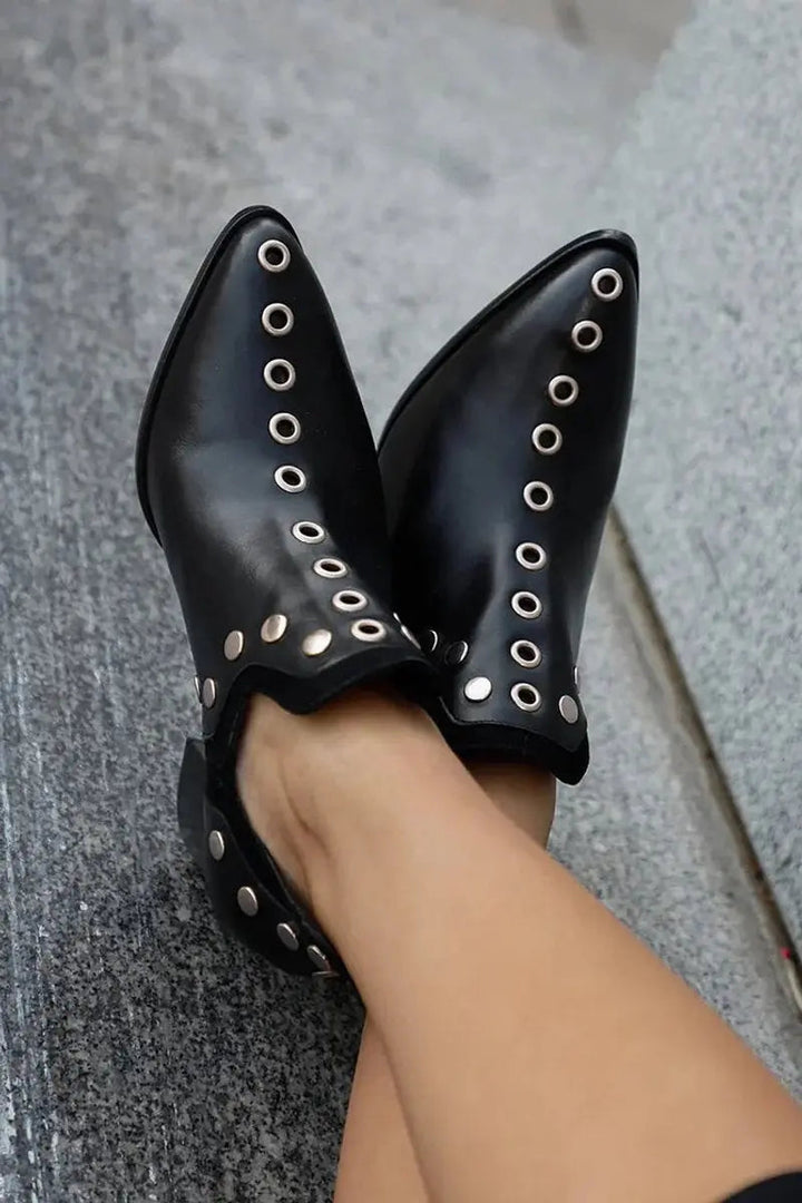 Fashionable women's studded ankle boots in black, with a chic pointed toe and sturdy mid block heel design.