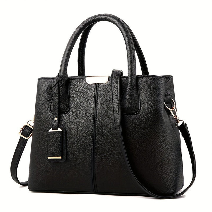 Women's stylish leather handbag with tote design, detachable crossbody strap, gold accents, spacious interior, elegant look.