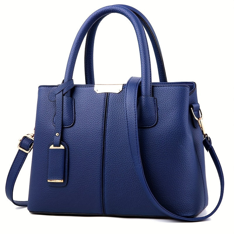 Women's stylish leather handbag with tote design, detachable crossbody strap, gold accents, spacious interior, elegant look.
