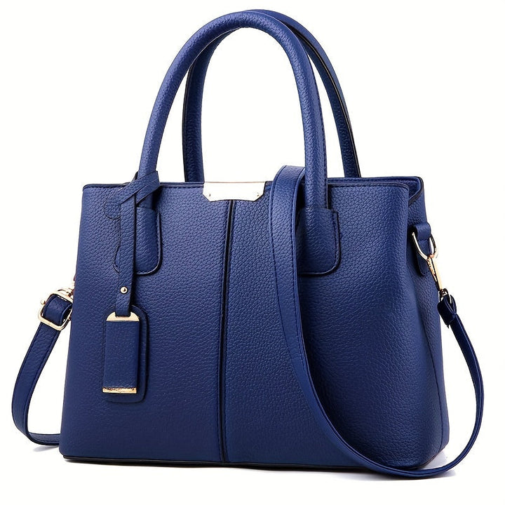 Women's stylish leather handbag with tote design, detachable crossbody strap, gold accents, spacious interior, elegant look.