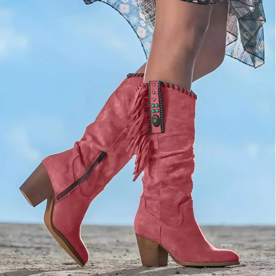 Stylish women's knee-high western fringe & tassel boots. Cowboy-inspired footwear with a block heel, great for festivals.