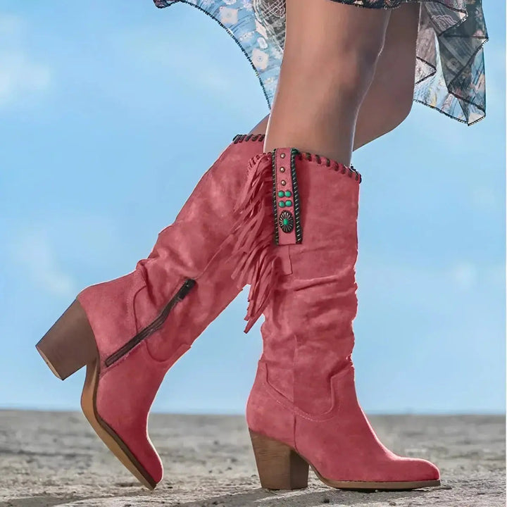 Stylish women's knee-high western fringe & tassel boots. Cowboy-inspired footwear with a block heel, great for festivals.