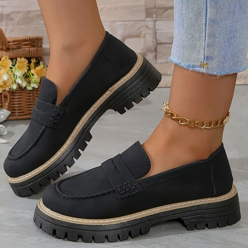 "Women's suede loafers with chunky sole and vamp strap, featuring rounded toe and premium suede for casual elegance."