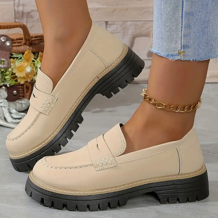 "Women's suede loafers with chunky sole and vamp strap, featuring rounded toe and premium suede for casual elegance."