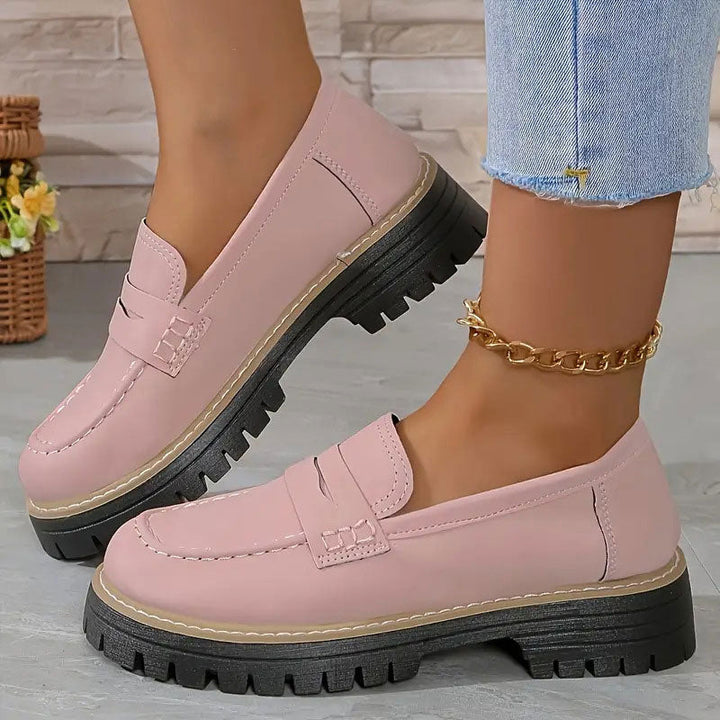 "Women's suede loafers with chunky sole and vamp strap, featuring rounded toe and premium suede for casual elegance."