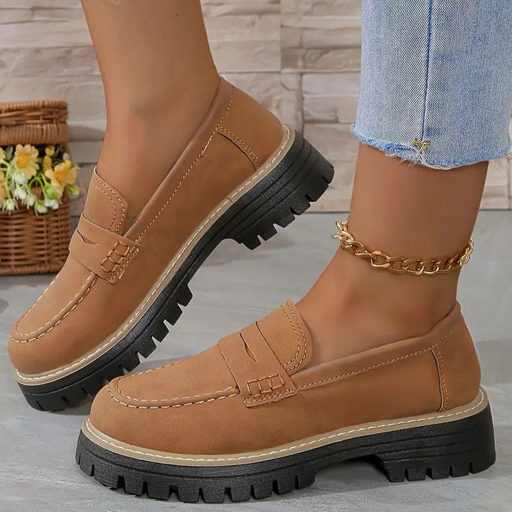 "Women's suede loafers with chunky sole and vamp strap, featuring rounded toe and premium suede for casual elegance."