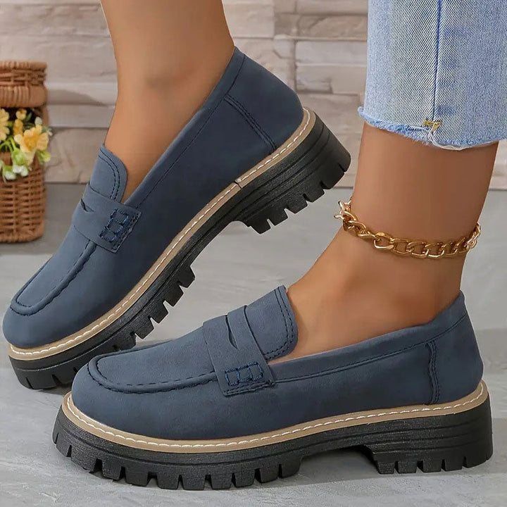 "Women's suede loafers with chunky sole and vamp strap, featuring rounded toe and premium suede for casual elegance."