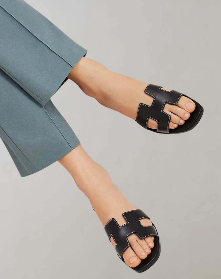 "Women's summer slippers, lightweight ergonomic design, breathable materials, durable anti-slip sole, casual style footwear."