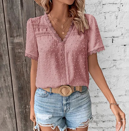 Stylish women's V-neck blouse with textured Swiss dots and elegant lace trim, ideal for warm weather.