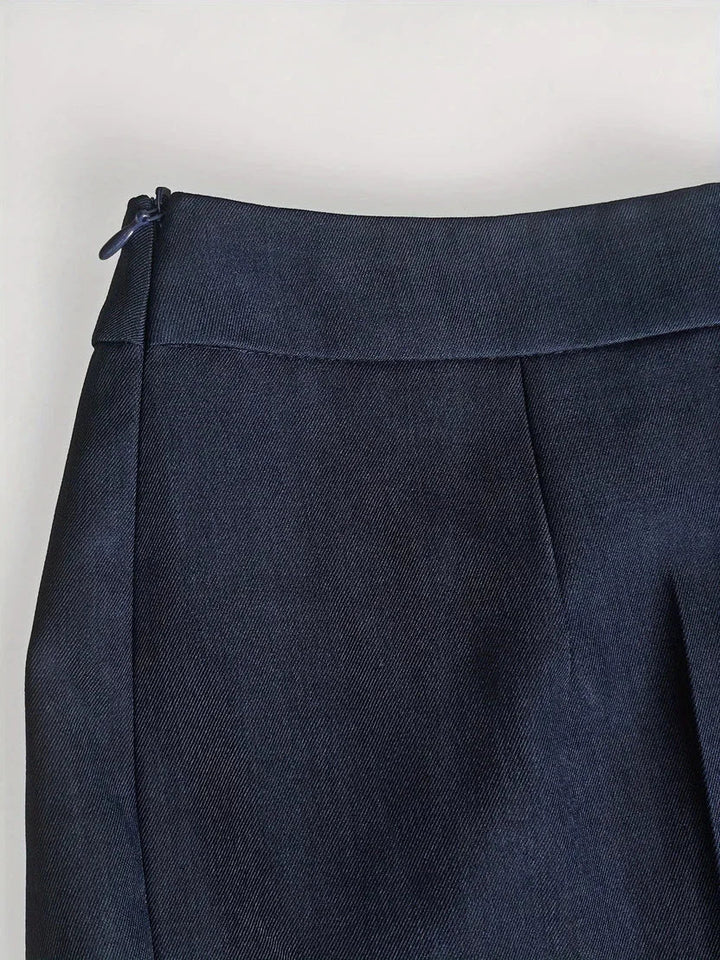 Versatile women's professional wear: tailored longline jacket & flared trousers set, perfect for office or events.
