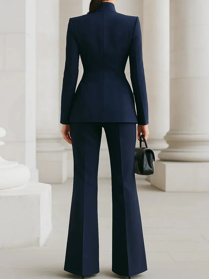 Chic women's longline jacket, part of a tailored two-piece set with flared trousers, for an elegant, modern look.
