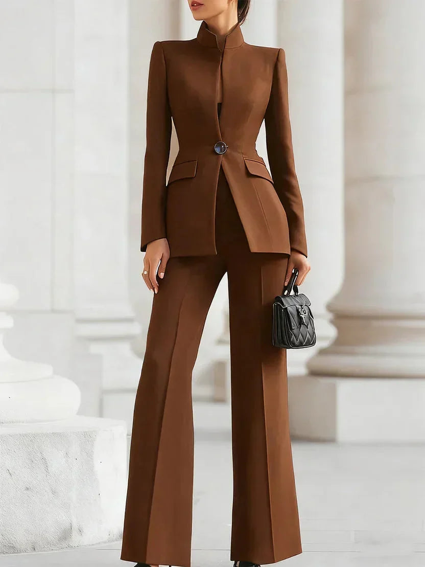 Women's tailored suit set showcasing a sleek longline jacket and flattering flared trousers, a modern two-piece.
