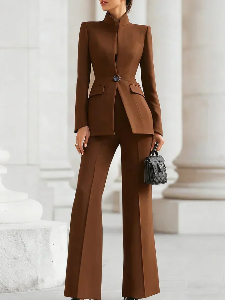 Women's tailored suit set showcasing a sleek longline jacket and flattering flared trousers, a modern two-piece.