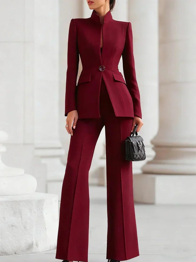 Statement women's tailored set with an elegant longline jacket & fashionable flared trousers for sophisticated style.