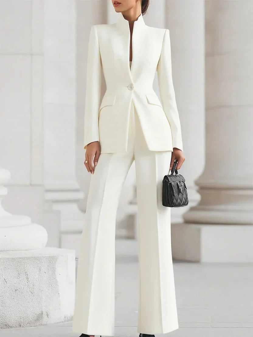 Modern women's tailored suit set: longline jacket & flared trousers for formal attire, evening, or office wear.