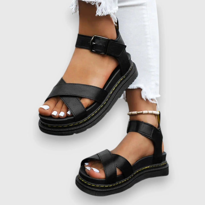 Women's teal platform sandals with stylish criss-cross adjustable straps, perfect for summer fashion & comfort.