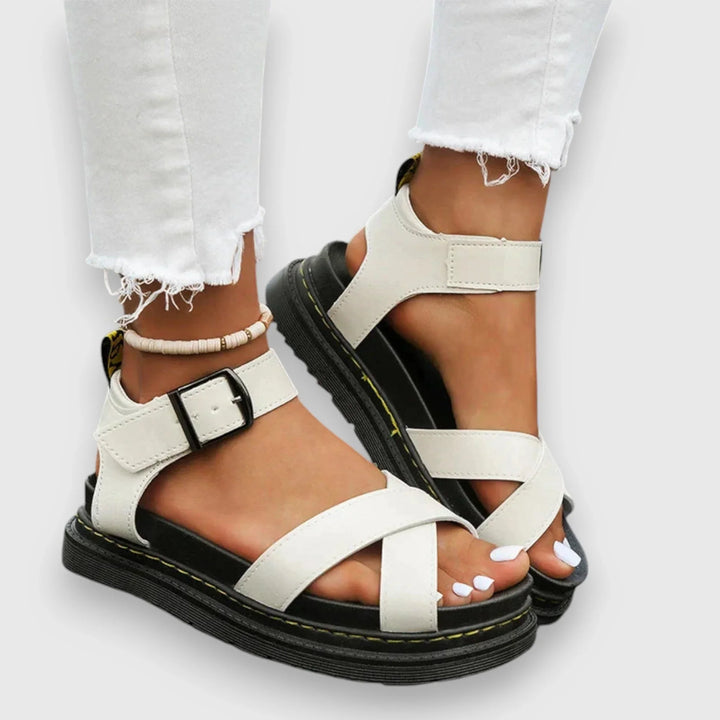 Stylish women's teal platform sandals featuring criss-cross straps, ideal for summer, vacation, and casual wear.